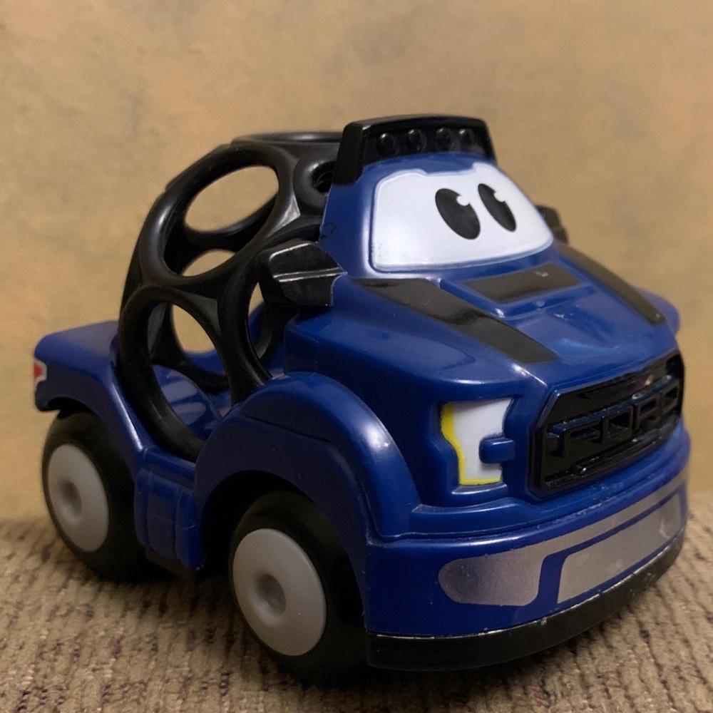 Bright Starts Ford Rattle & Roll F-150 Raptor toy truck.
